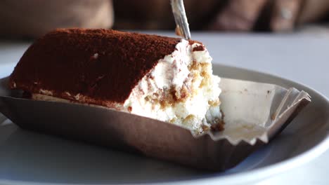 chocolate and cream cake on a plate on table