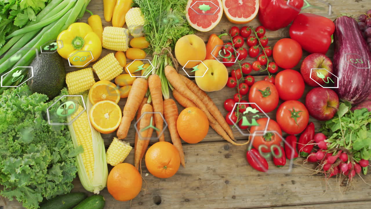 Colorful fruits and vegetables on wooden surface with digital animation overlay