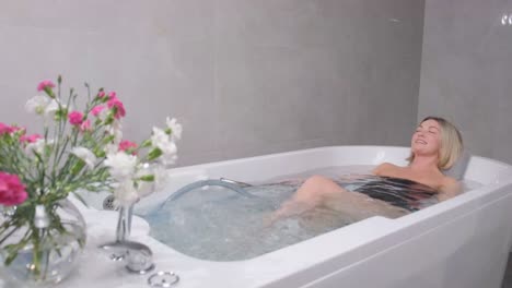 beauty and healthy treatments in sauna, blonde woman in felt hat relaxing in steam bath, recovery vitality and releasing stress, relaxation in spa center, traditions for healthy lifestyle
