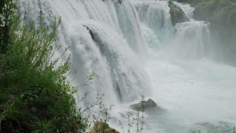 A-waterfall-of-a-pure-wild-river-located-in-a-green-rainforest