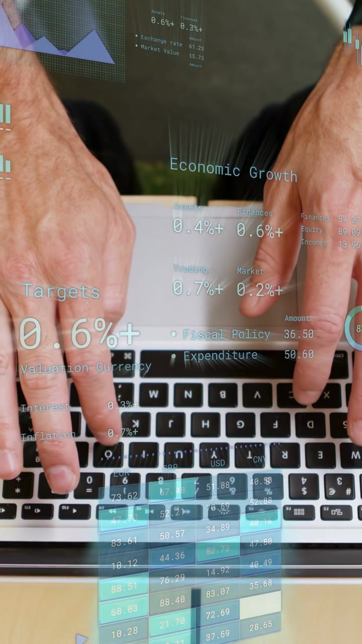 Vertical video: Left index pressing central key and hands typing on keyboard, updating finance HUD