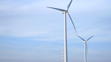 Wind-turbine-farm-with-blue-sky-no-people-stock-video