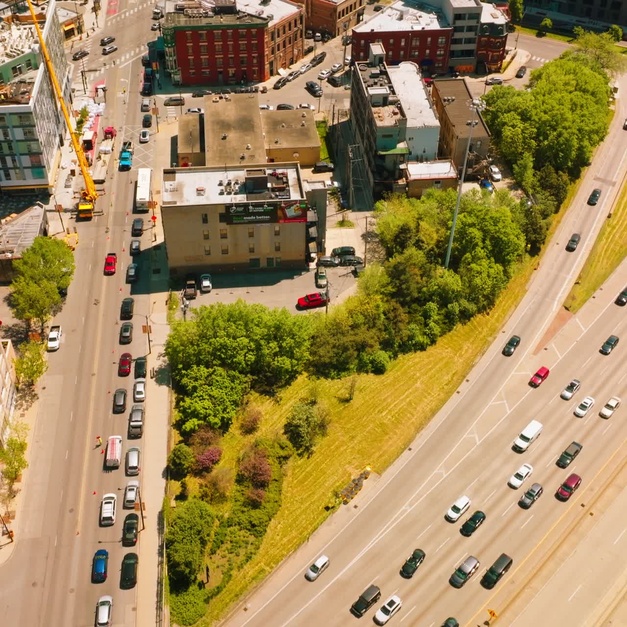 Busy broad roads crossing the city. Lively and vibrant Chicago city at beautiful sunny day. Top view