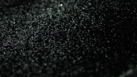 glitter particles on black background