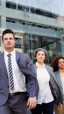 business people walking in office building