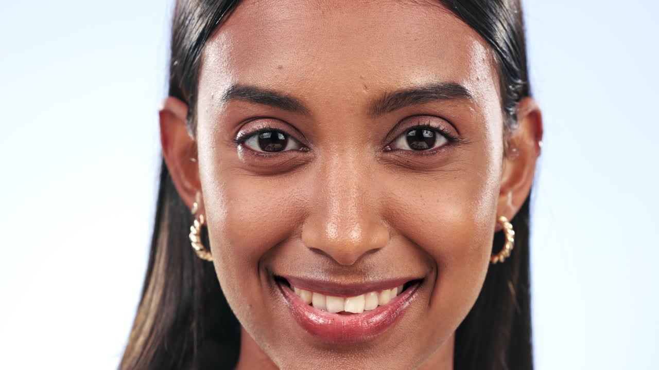 Face, funny and wink with a playful indian woman