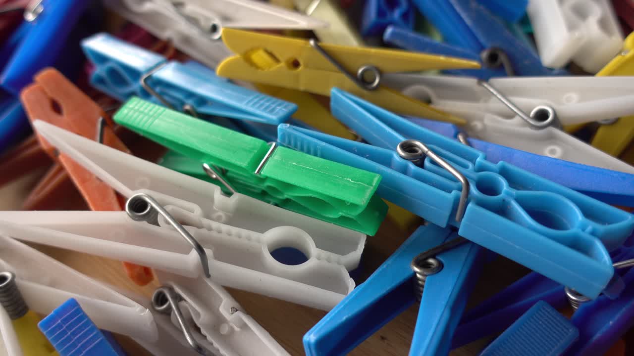 Multi coloured plastic clothes pegs