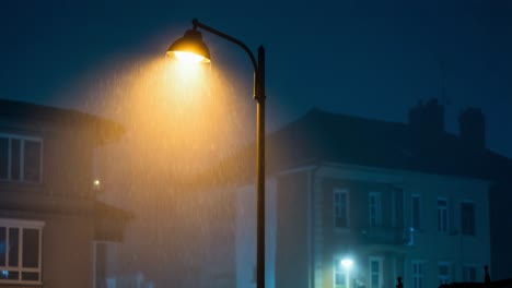 rainy night under a street lamp