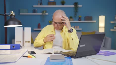 home office worker old man reading a book.