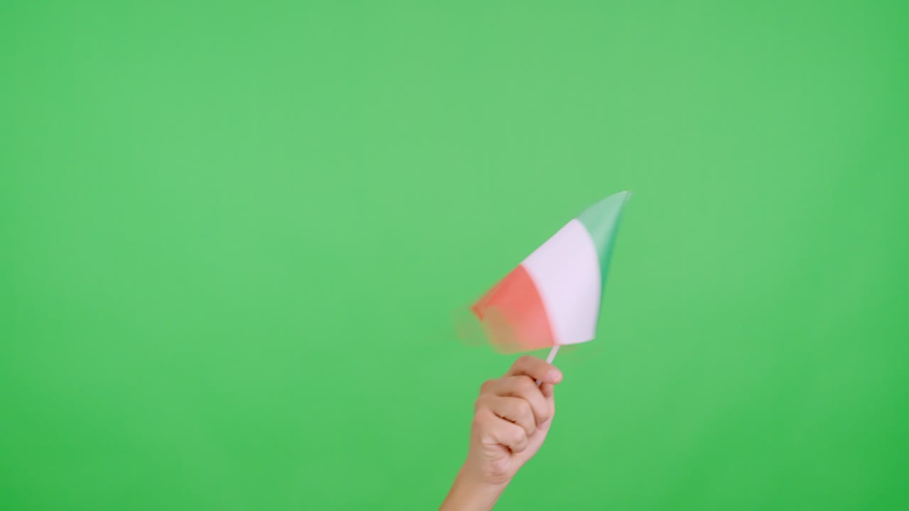 Hand waving a pennant of a italian national flag