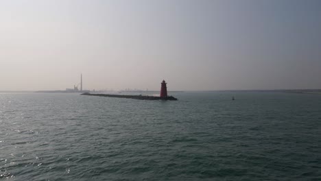 Drone-shot-of-a-lighthouse-with-the-Dublin-cityscape-in-the-background