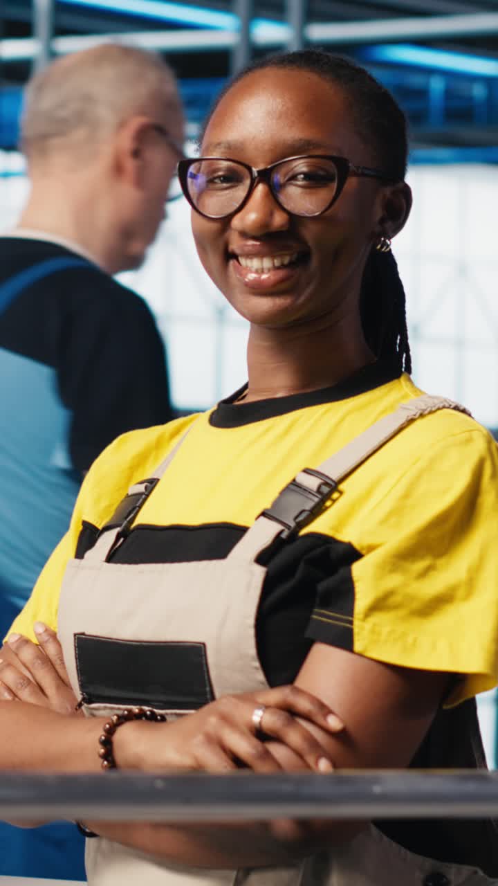 Vertical video Portrait of joyous smart solar panels manufacturing factory expert
