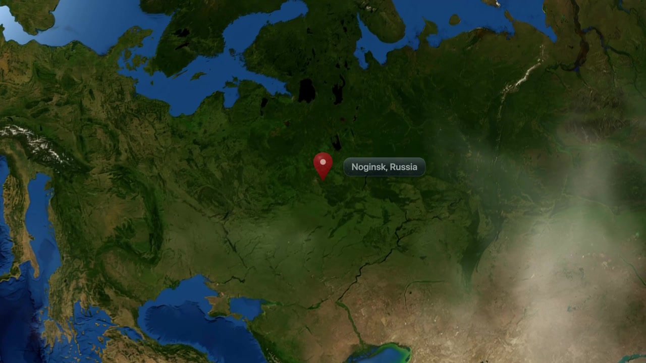 Satellite animation zooms from deep space into planet Earth, pinpointing Noginsk in Russia. Includes NASA public domain imagery.