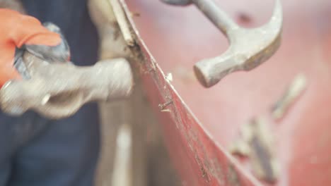 Hammering-out-rusty-screws-from-fiberglass-canoe-gunwale