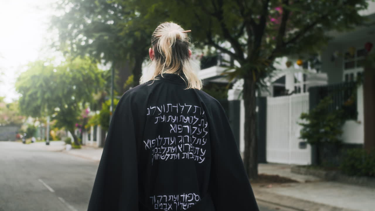 Chic Man wearing Black Gone Walking Outdoors