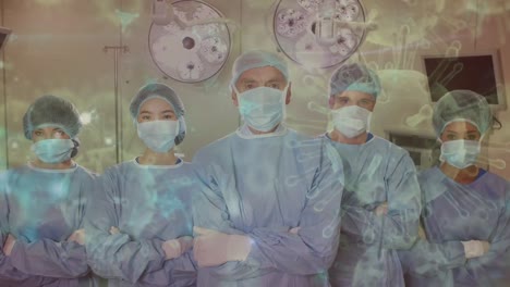 Animation-of-covid-19-cells-over-diverse-surgeons-wearing-face-masks-in-operating-theatre