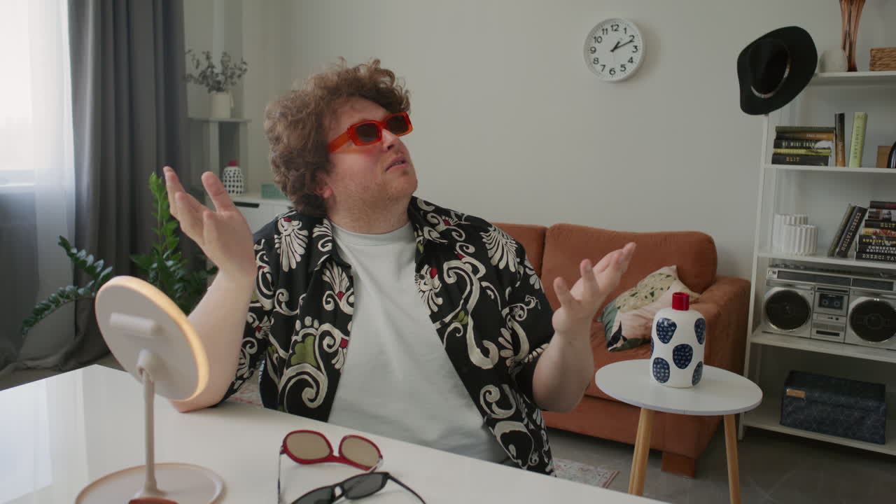 Male Fashion Blogger Trying on Stylish Sunglasses and Commenting on Camera