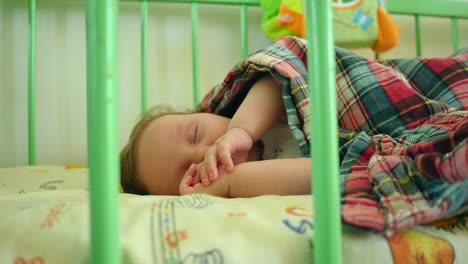 baby sleeping in crib