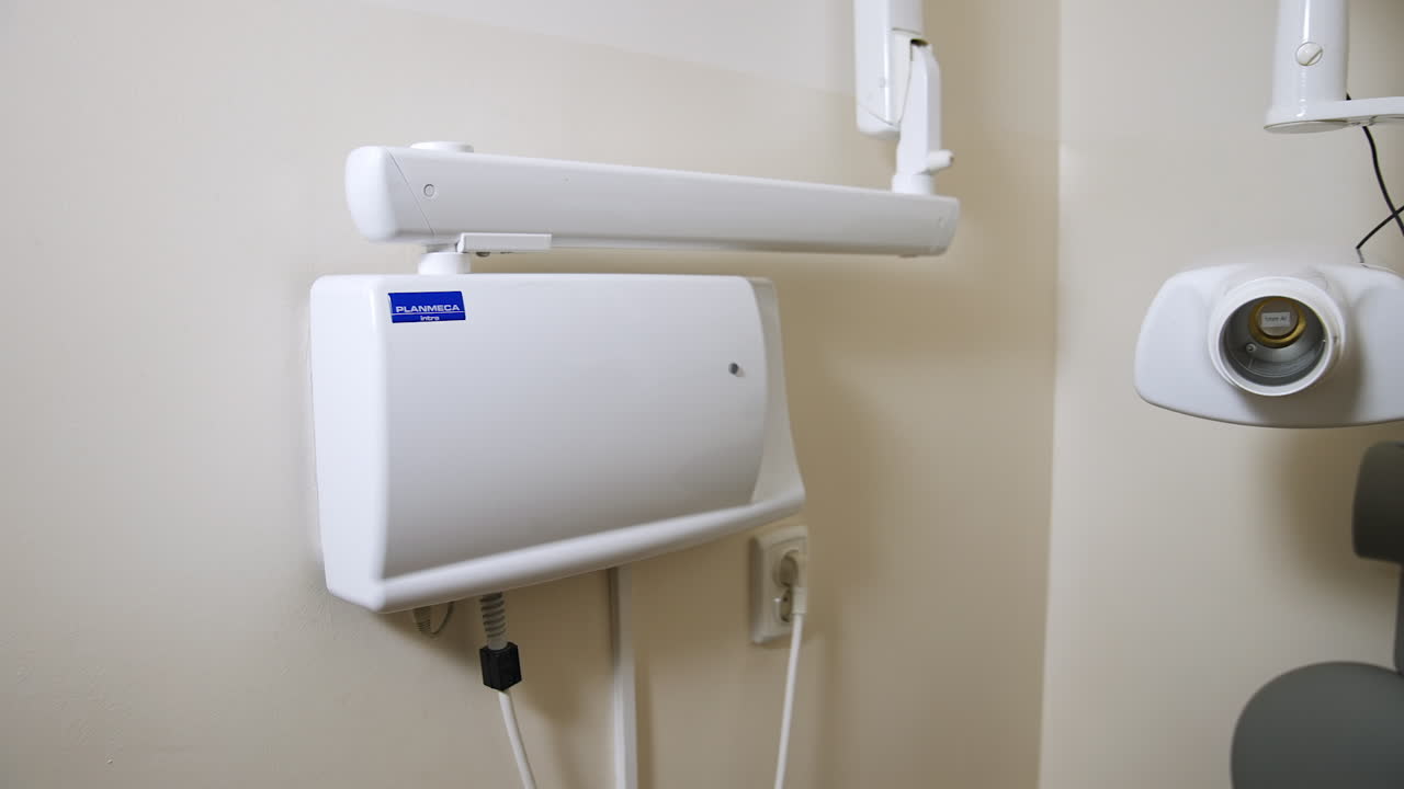 Dental x-ray machine on the wall of the medical cabinet. Equipment for x-ray scanning.