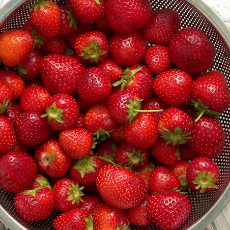 delicious healthy fresh strawberries placed in metal strainer  organic natural food concept