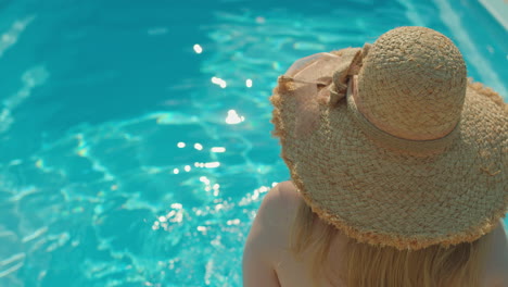 woman relaxing by poolside