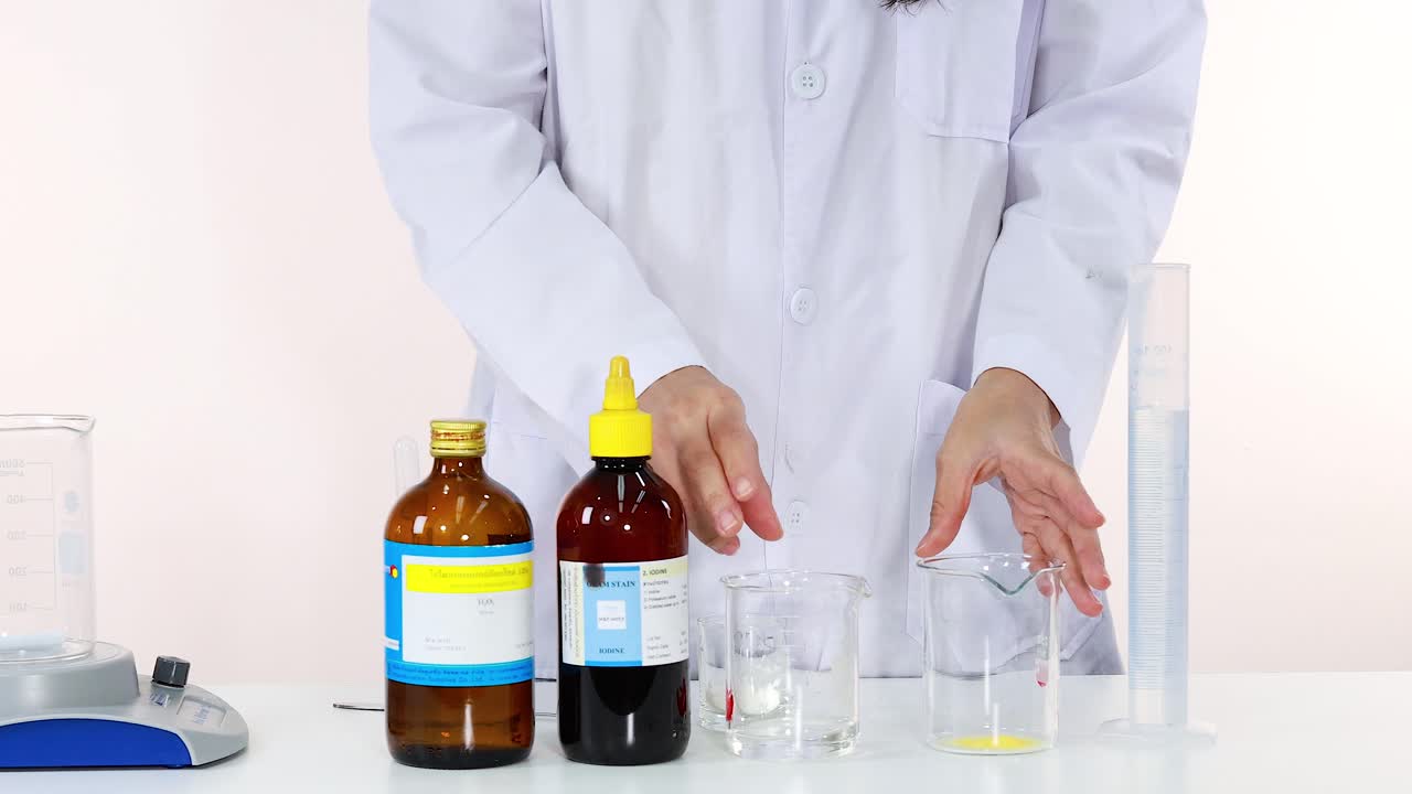 Scientist carefully preparing chemicals for a laboratory science experiment