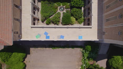 The-private-and-modest-garden-of-the-Monastery-of-the-Silent-Monks,-Latrun---the-monks-lifestyle-in-based-on-simplicity-and-harmony-with-nature---tilt-up-reveal-shot