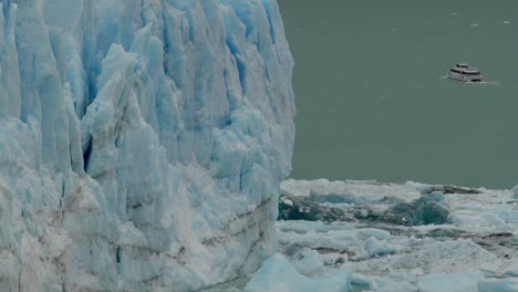 A-boat-sits-near-the-side-of-a-giant-glacier-in-Patagonia-Argentina-2