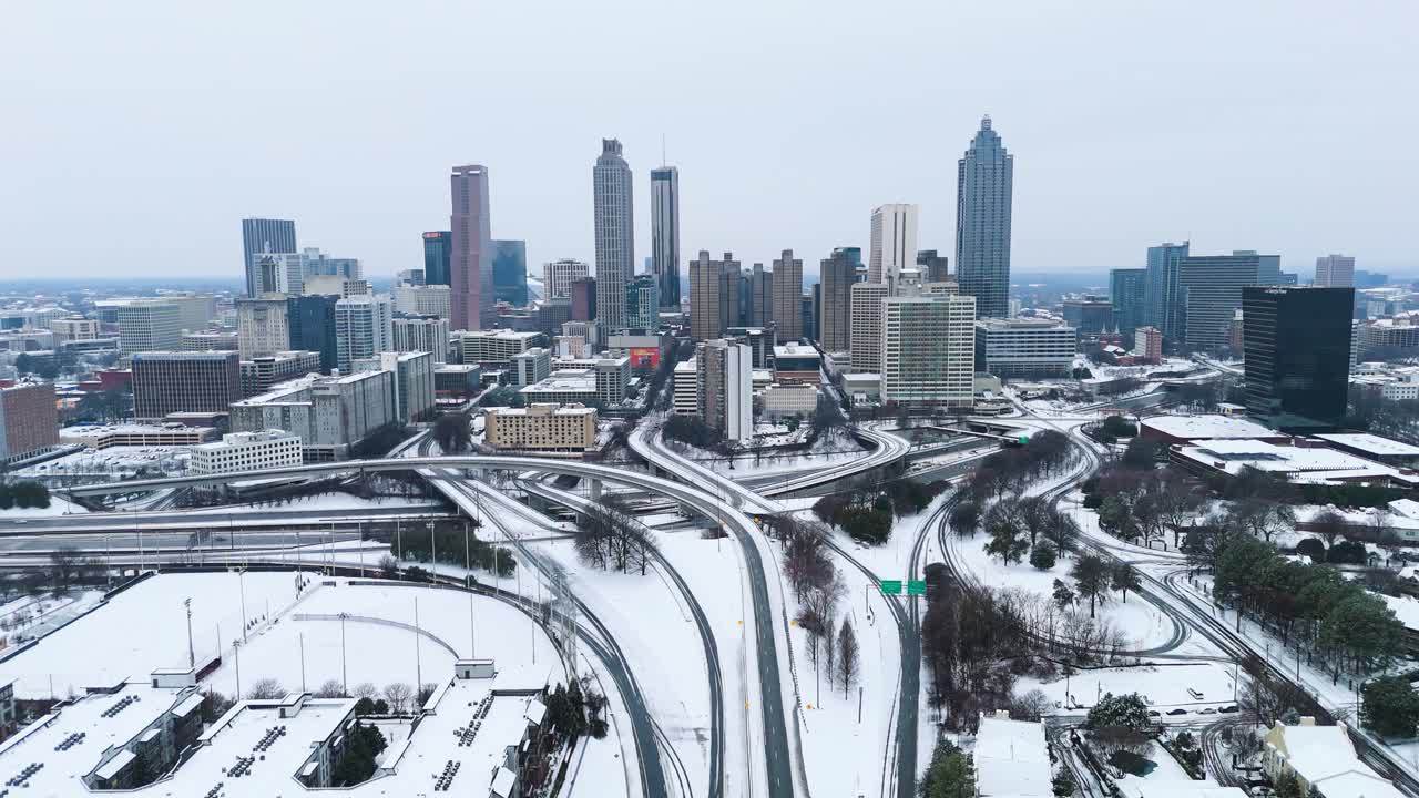 Aerial static shot of snow covered Downtown Atlanta Georgia from the Jackson Street Bridge on January 10th 2025.
