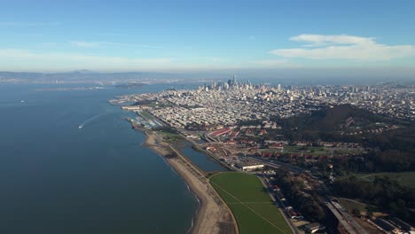 aerial drone view approaching the san francisco metropolis, in sunny california