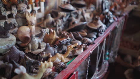 carved animal knick knacks of various colors, in morocco tourism store