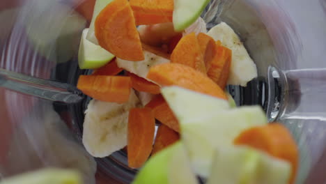 Mix-fruits-dropped-blender-in-super-slow-motion-close-up.-Vitamin-cocktail.