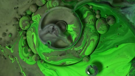 green and grey acrylic chemical reaction. slow motion