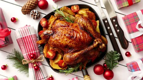 roasted whole chicken or turkey served in iron pan with christmas decoration