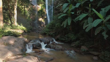 tranquil waterfall in lush green jungle