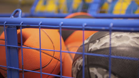 close- up of basketballs in the storage basket