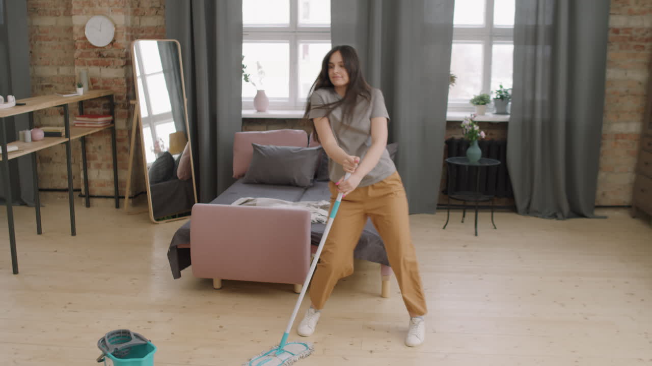Woman Dancing and Mopping Floor