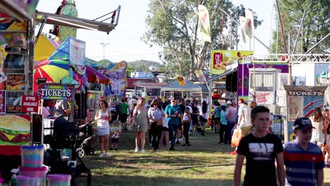 crowds enjoying a vibrant outdoor fair