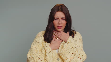 unhealthy woman coughing covering mouth with hand, feeling sick, allergy or viral infection symptoms