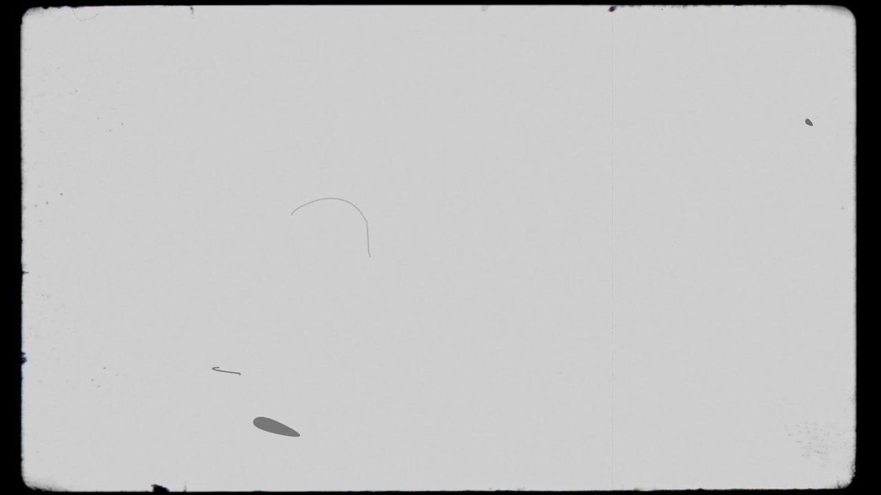 Minimalist retro cinema frame overlay with gentle film scratches and dust speckles