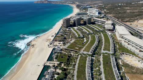 Beachfront-resort-in-Los-Cabos-Mexico-Aerial-reveal-of-ocean