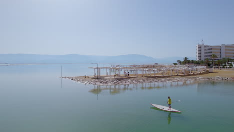 Lifeguard-on-a-standup-paddle-in-the-Dead-Sea