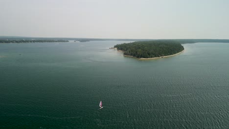 aerial flyout of windsurfer on lake huron, michigan