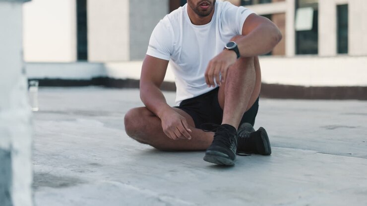 Fitness, man and shoes in sports preparation