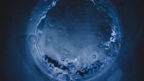 condensed water on glass bubbles motion and macro, water bubbles on glass, close up