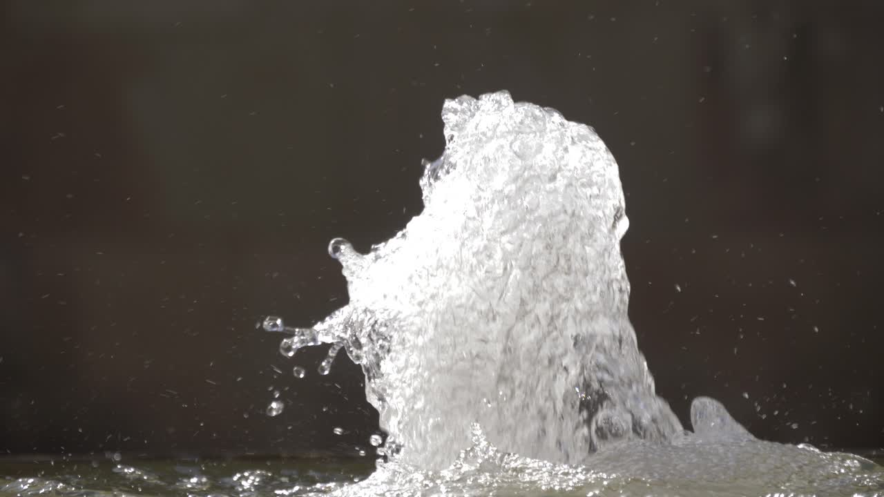 Epic water fountain with water coming out in the middle of Murcia Spain on a hot day