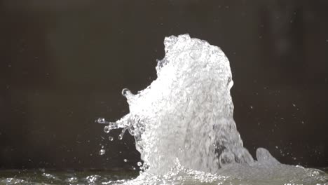 epic water fountain with water coming out in the middle of murcia spain on a hot day