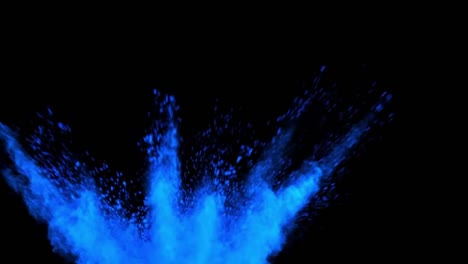 blue color powder splashed forming smoke. closeup view