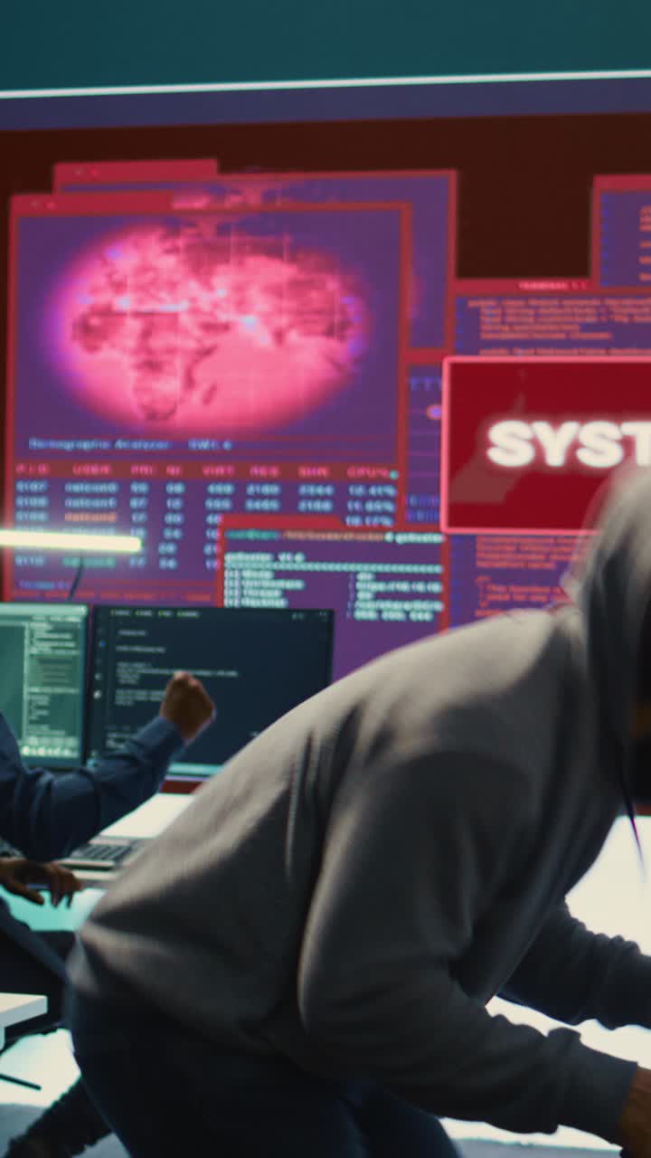 Hacker in Hoodie Celebrates Successful Cyber Attack