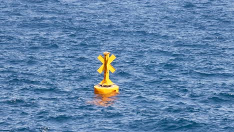 yellow buoy floating in monte carlo waters